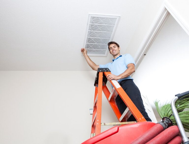 man checking vent